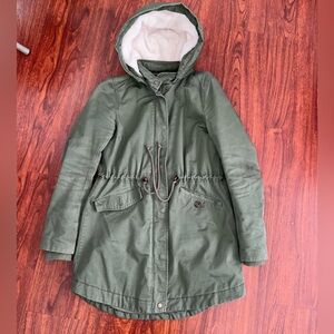Olive green parka with adjustable waist and fleeced hood #winter